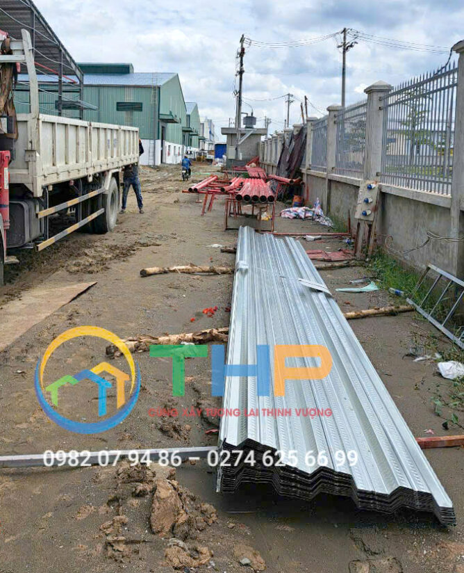 Metal sheets and pipes on ground